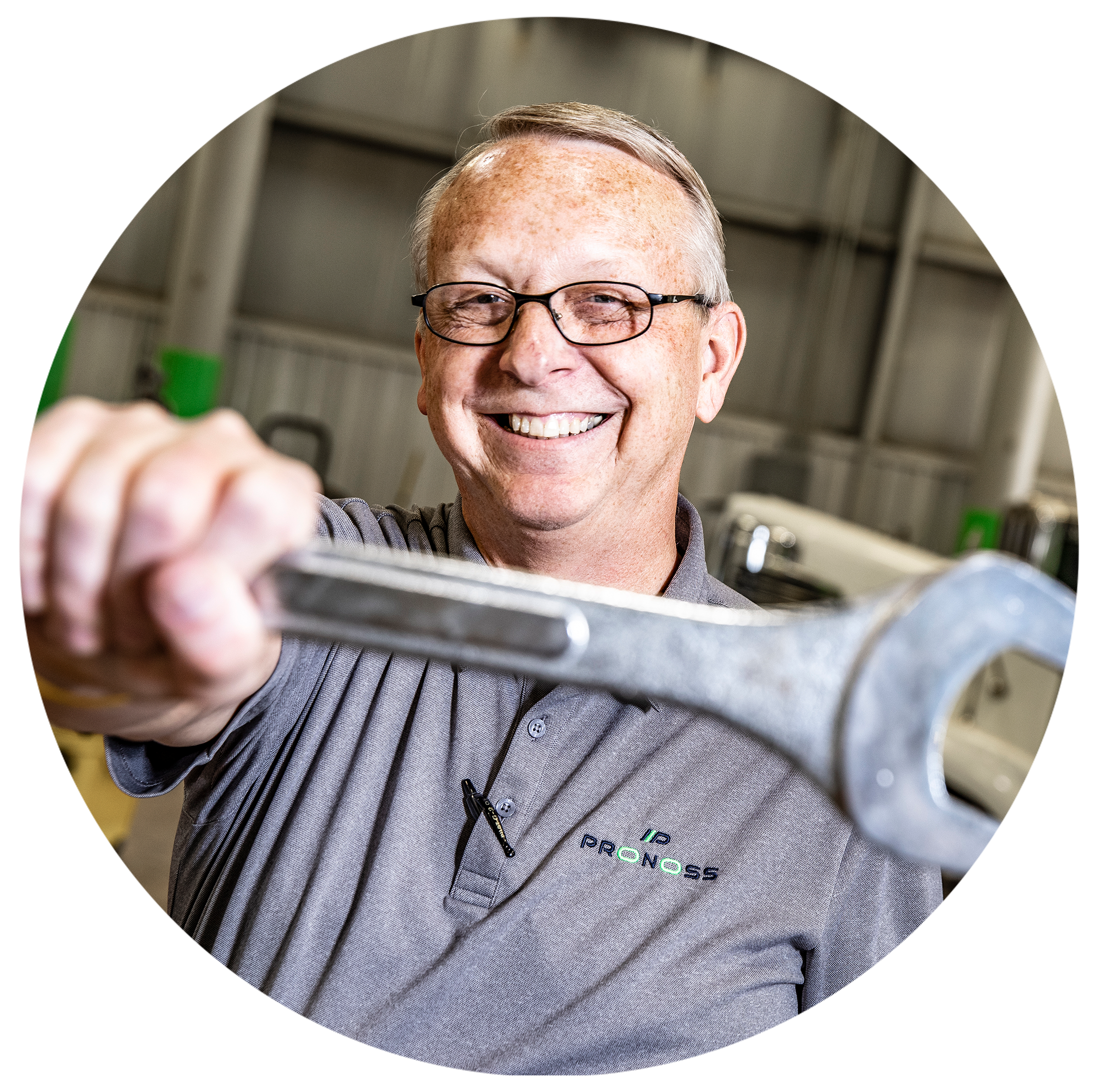 technician holding wrench 