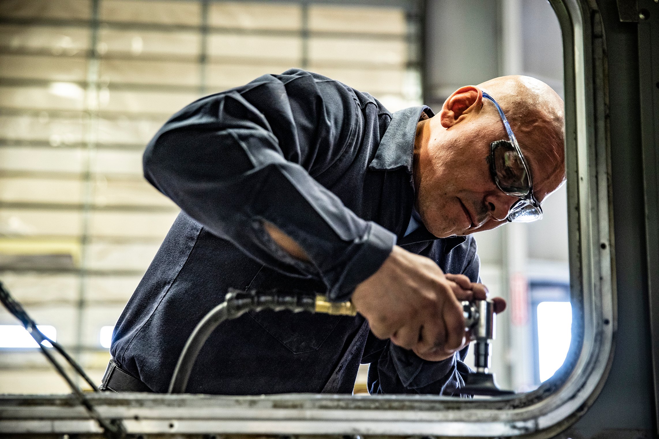 technician working on truck window